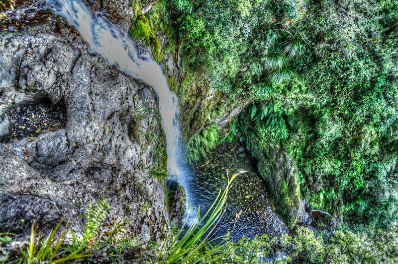 waterfall valley new zealand steep torrent group mountain blue