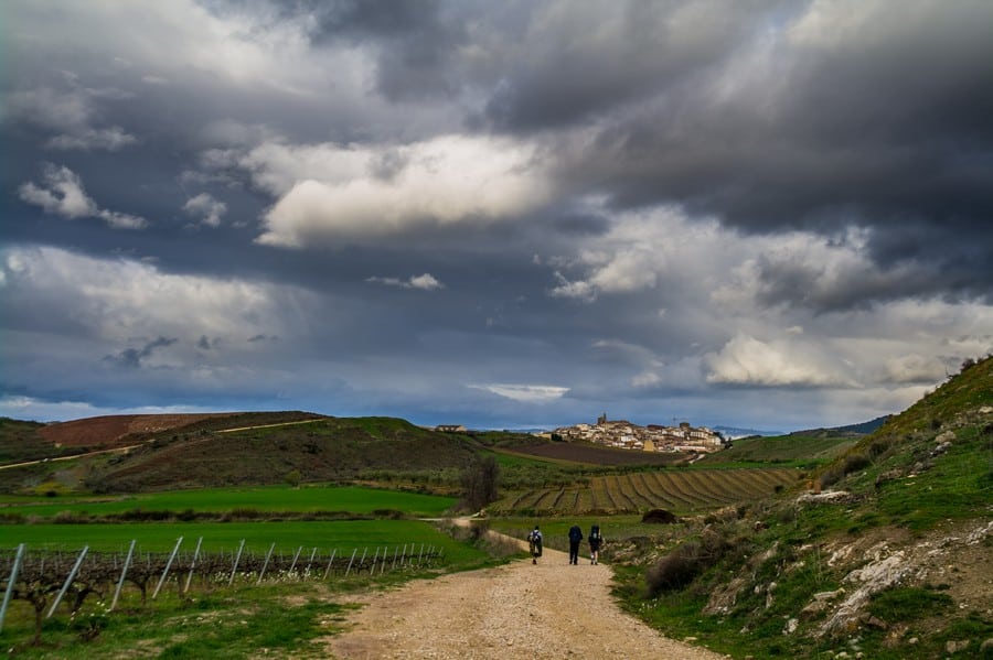 Pilgrims approaching Cirauqui, Spain