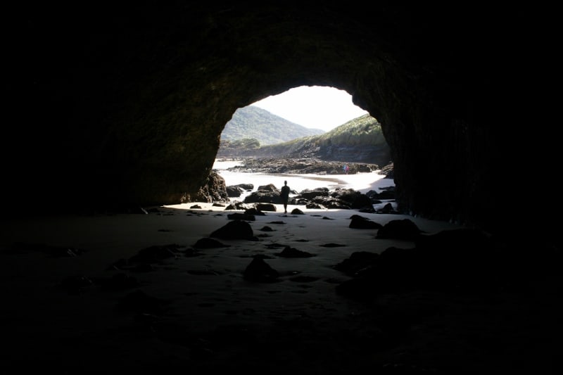 Large cave at left end of Bethells beach