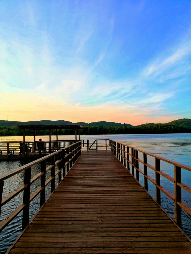 brown wooden dock over body of water 1227520