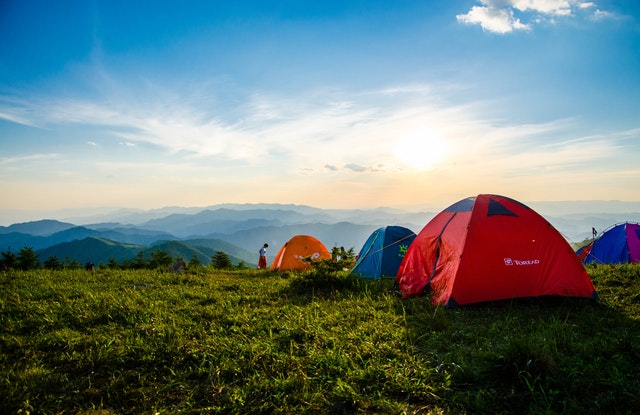 photo of pitched dome tents overlooking mountain ranges 1687845
