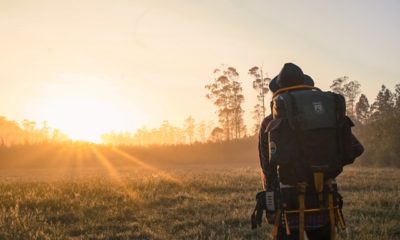 man in black backpack during golden hour 1230302