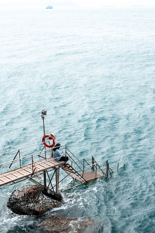 woman sitting on dock 1738976