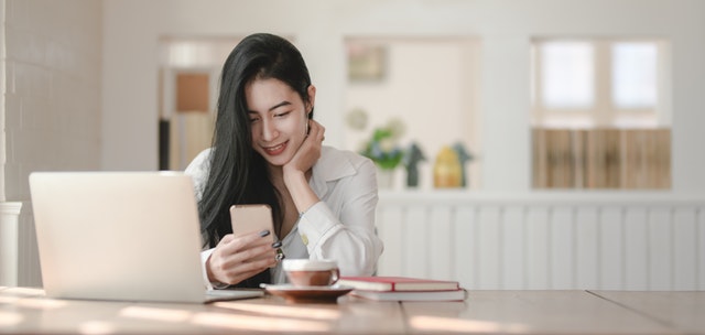 shallow focus photo of woman using smartphone 3803219