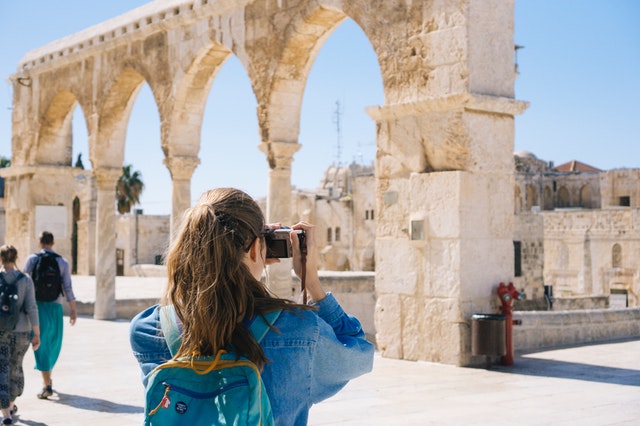 woman taking pictures of ruins 2087391