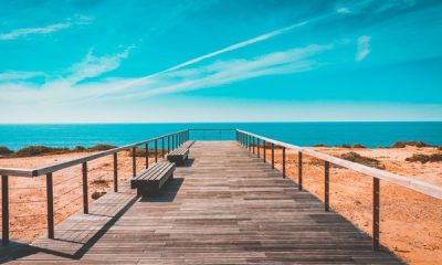 beach bench boardwalk clouds 462024