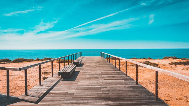 beach bench boardwalk clouds 462024