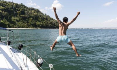 handsome young man enjoying time boat