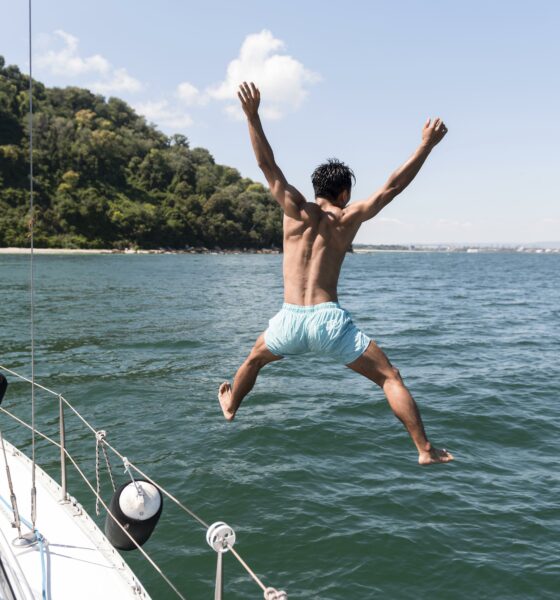 handsome young man enjoying time boat