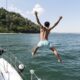 handsome young man enjoying time boat